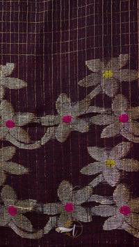 Close-up of floral patterned fabric with a grid background