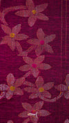 Close-up of a fabric with floral patterns on a dark red background