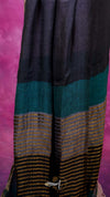 Black and teal striped fabric on a pink background