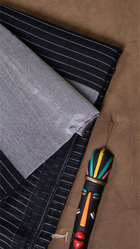Colorful duster with a decorative handle on a textured surface