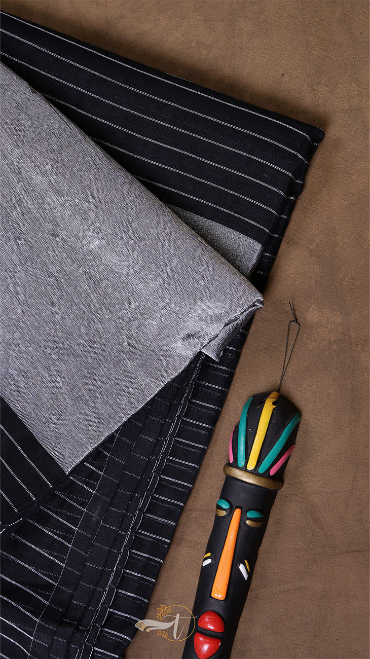 Colorful duster with a decorative handle on a textured surface