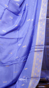 Blue saree with white floral patterns on a plain background