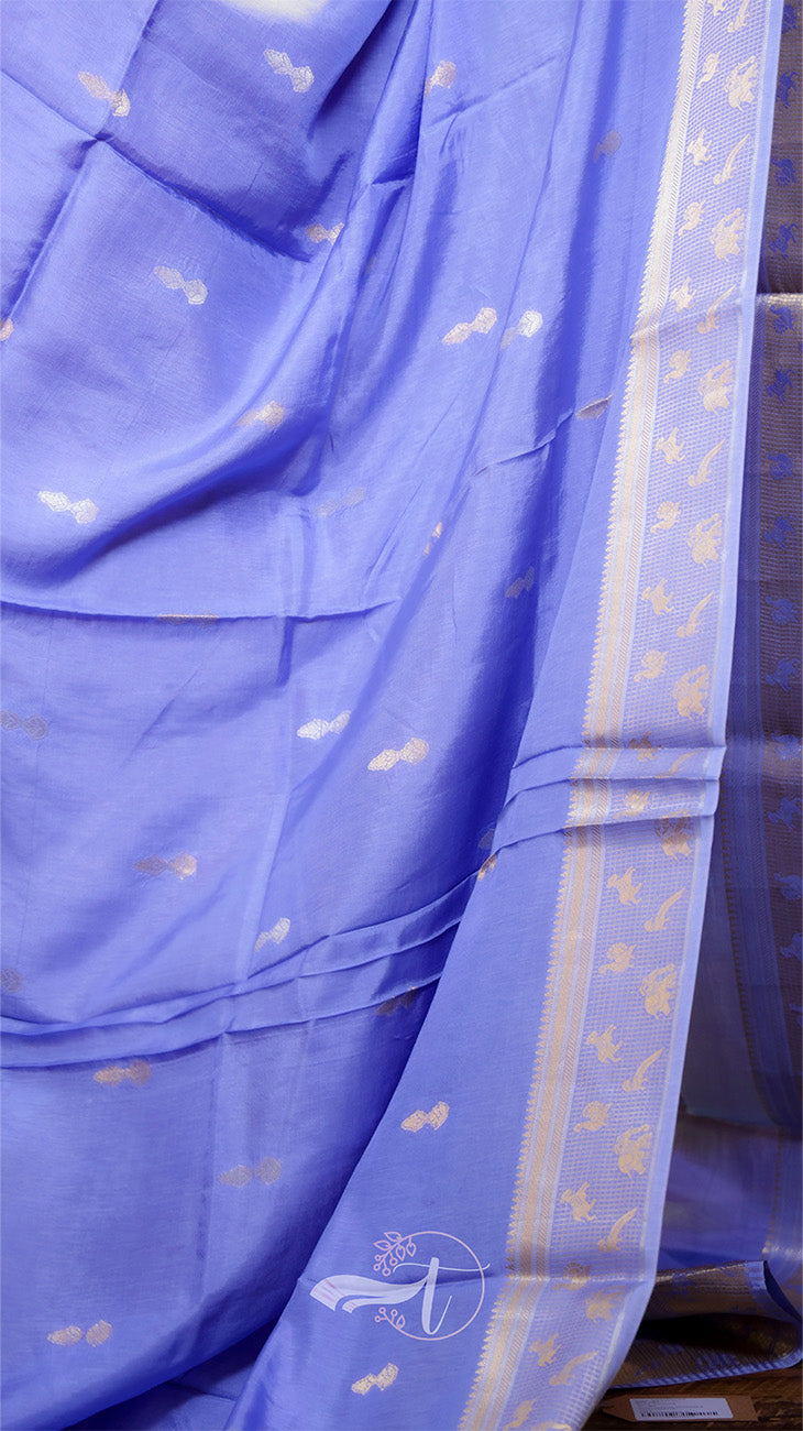 Blue saree with white floral patterns on a plain background