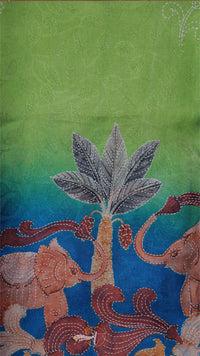 Decorative fabric with elephants and a tree design on a green and blue gradient background