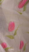 Sheer fabric with pink tulip designs on a beige background