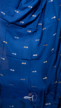 Blue fabric with white fish patterns and a logo in the corner