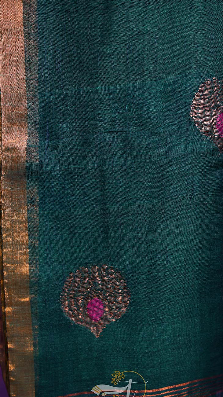 Teal fabric with decorative patterns and a gold border