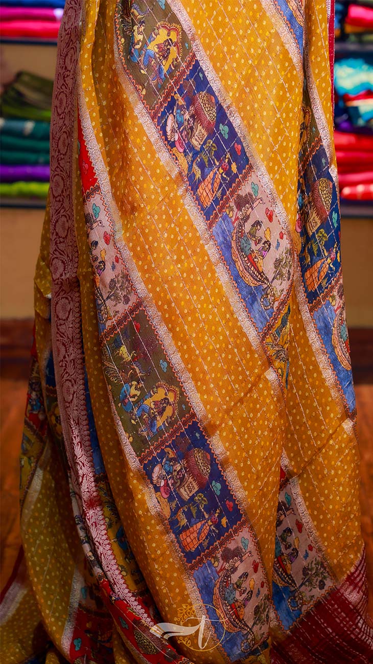 Colorful traditional fabric with intricate patterns on a yellow background