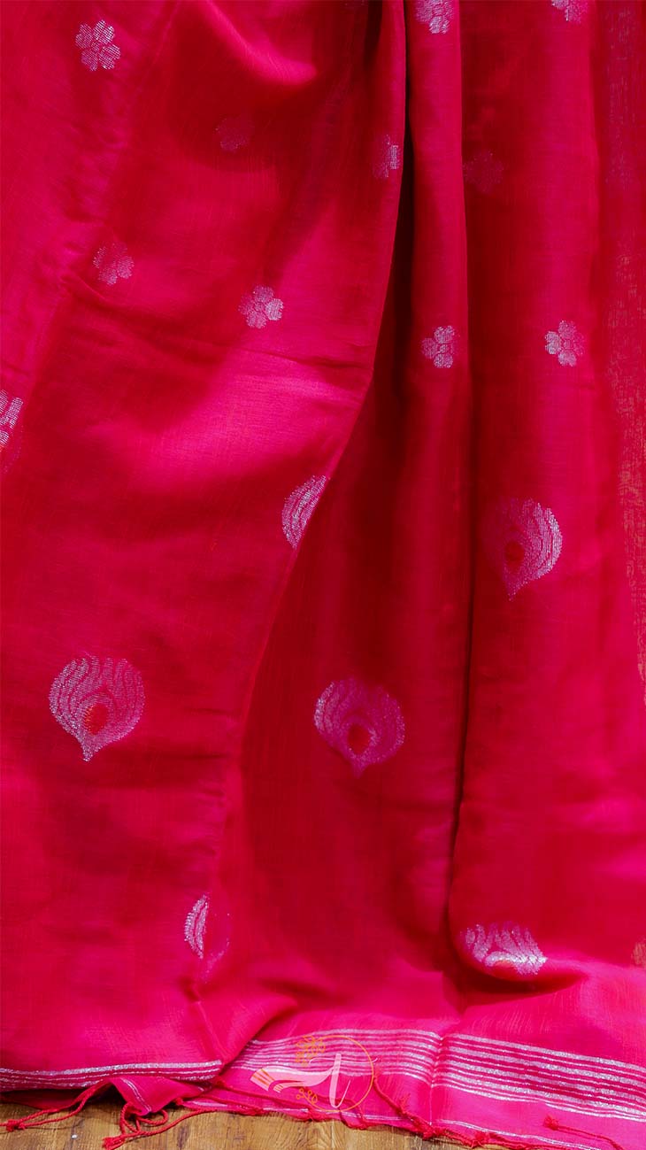 Red fabric with white patterns on a wooden surface