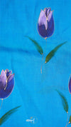 Purple tulip flowers on a blue background