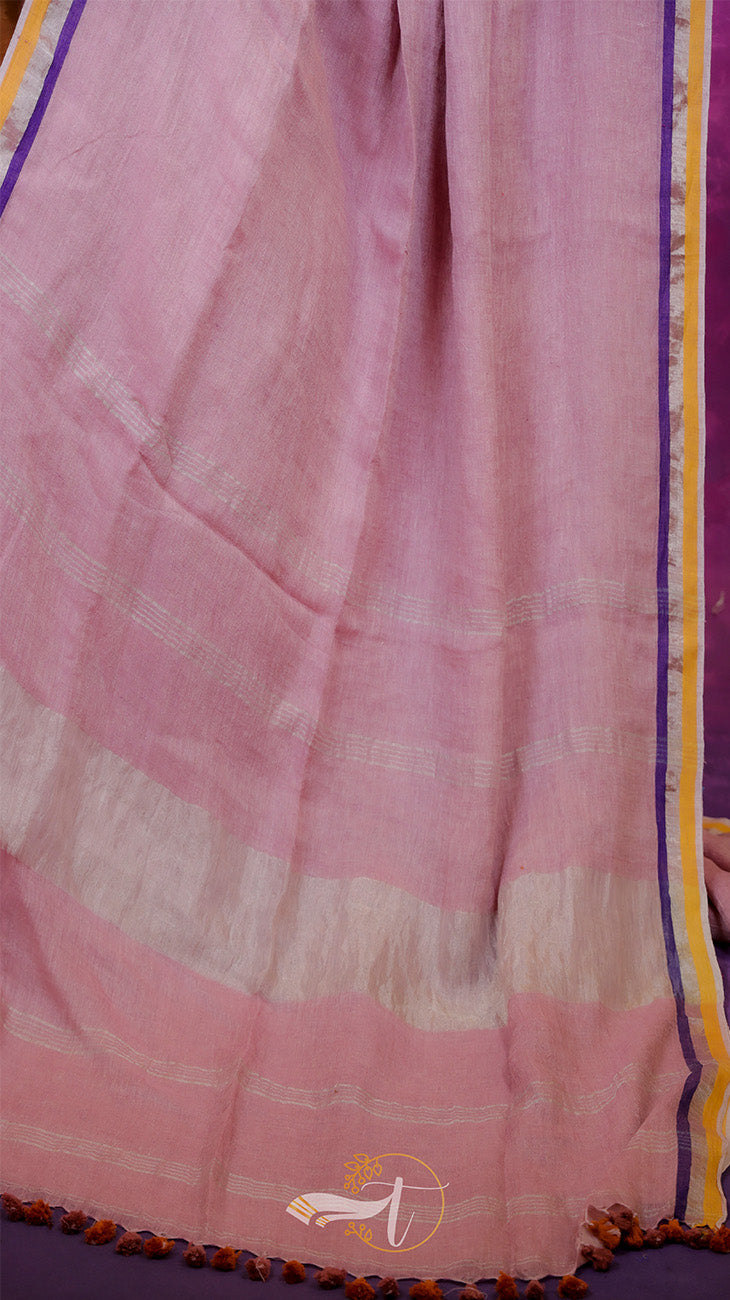Pink fabric with a subtle pattern on a purple background