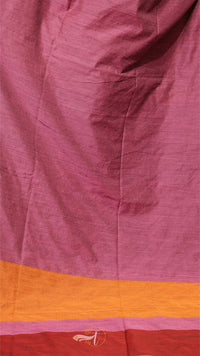Close-up of a fabric with a pink and orange border, featuring a brand logo.