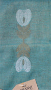 Teal fabric with embroidered floral design, featuring the brand 'Thanvi'.