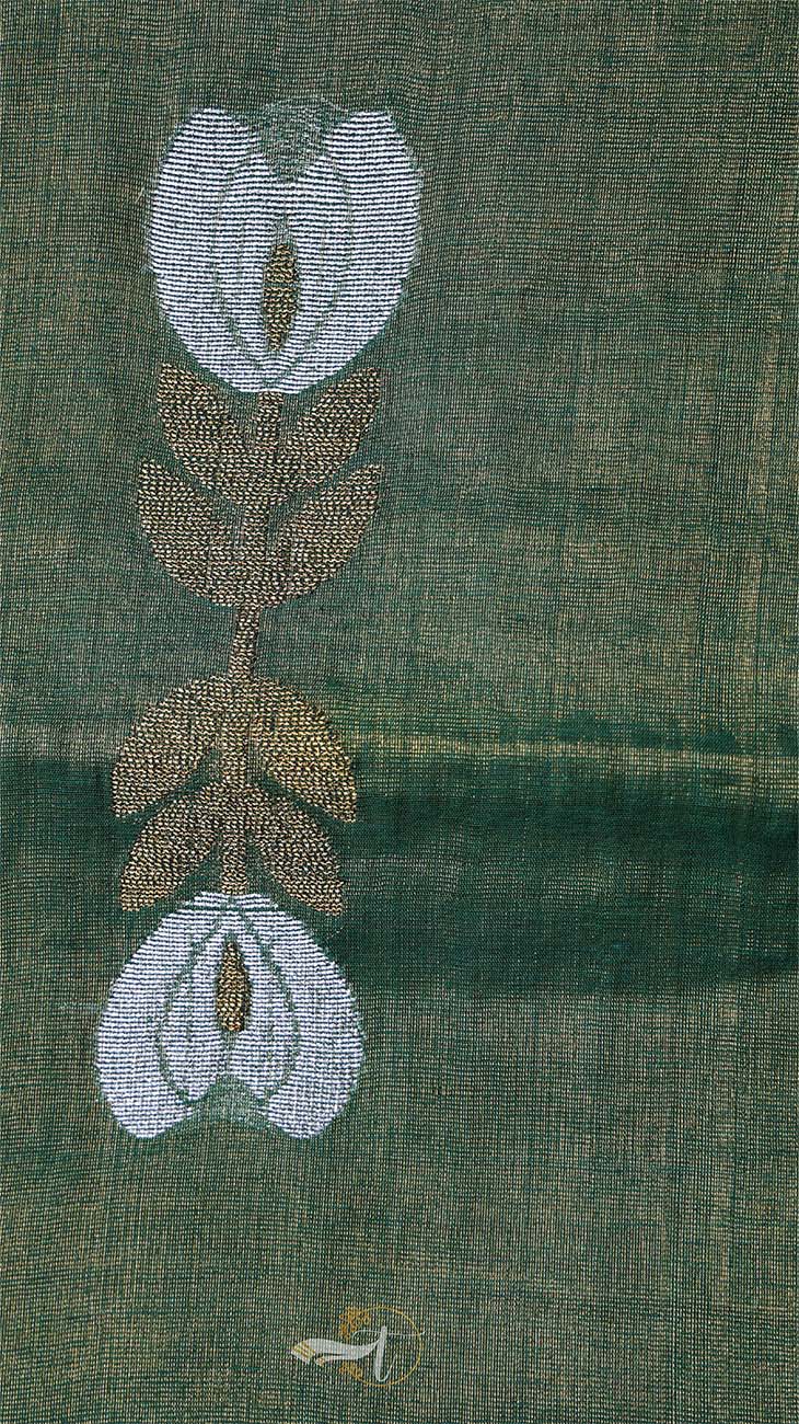 Embroidered design of flowers on a green fabric background