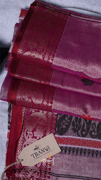 Maroon fabric with intricate patterns and a 'Thanvi' tag on a white background