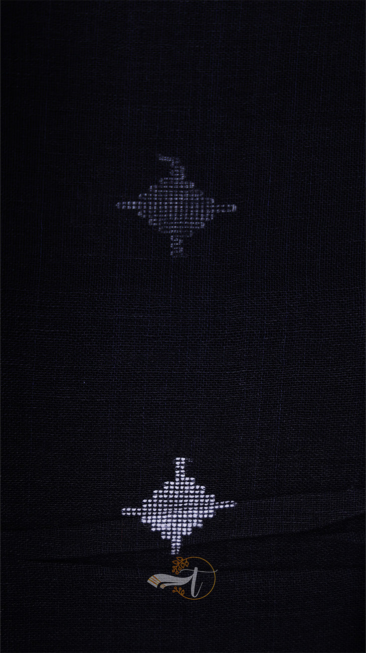 Black fabric with embroidered patterns on a dark background