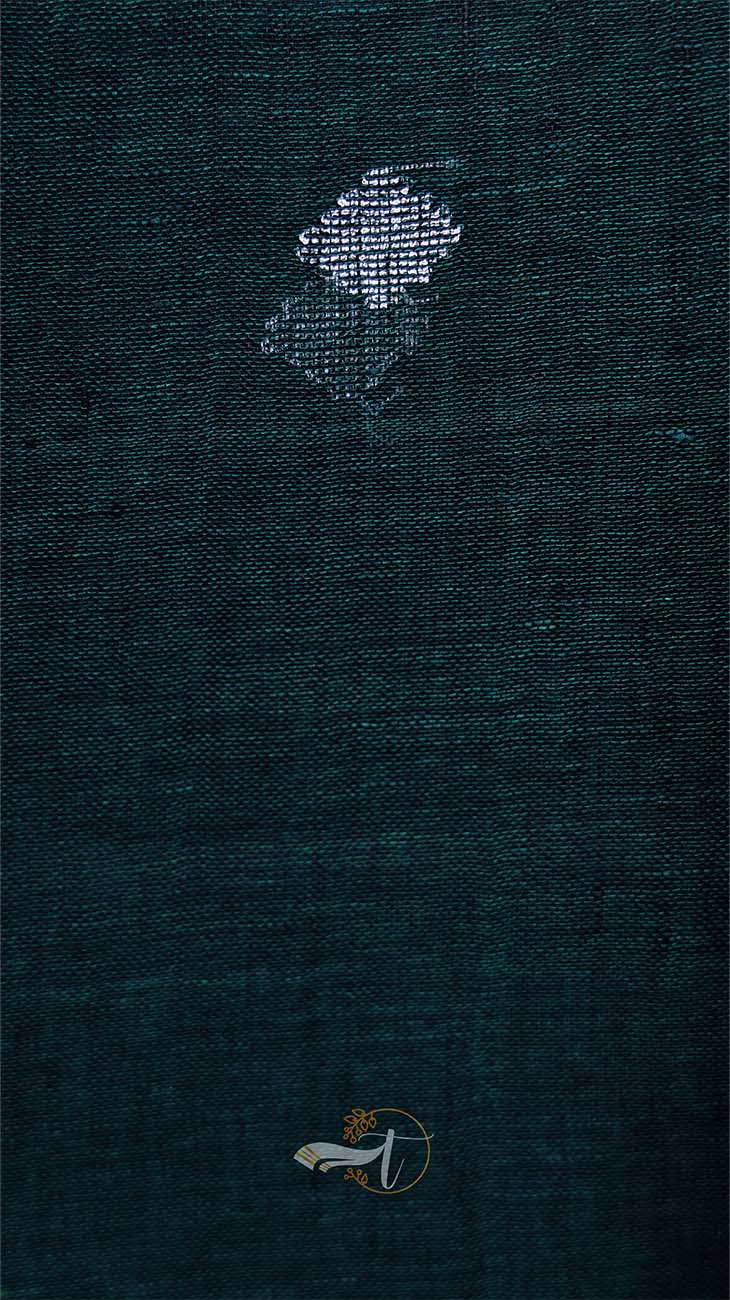 Dark blue fabric with embroidered designs on a dark background