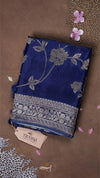 Blue fabric with floral patterns on a brown background