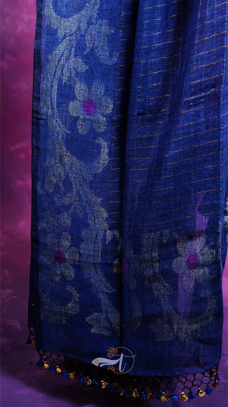Blue patterned fabric with decorative elements on a purple background