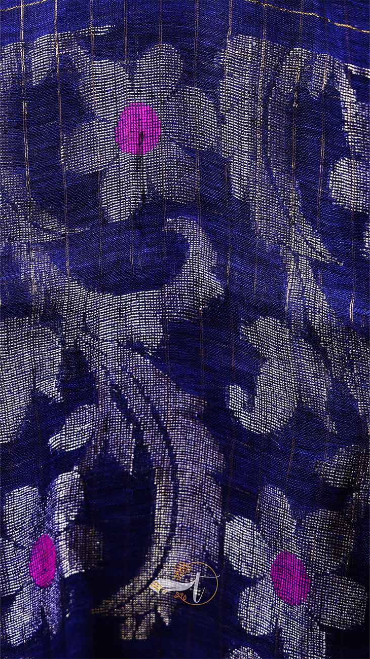 Close-up of a floral patterned fabric with purple flowers on a dark background