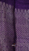 Close-up of a purple fabric with intricate patterns