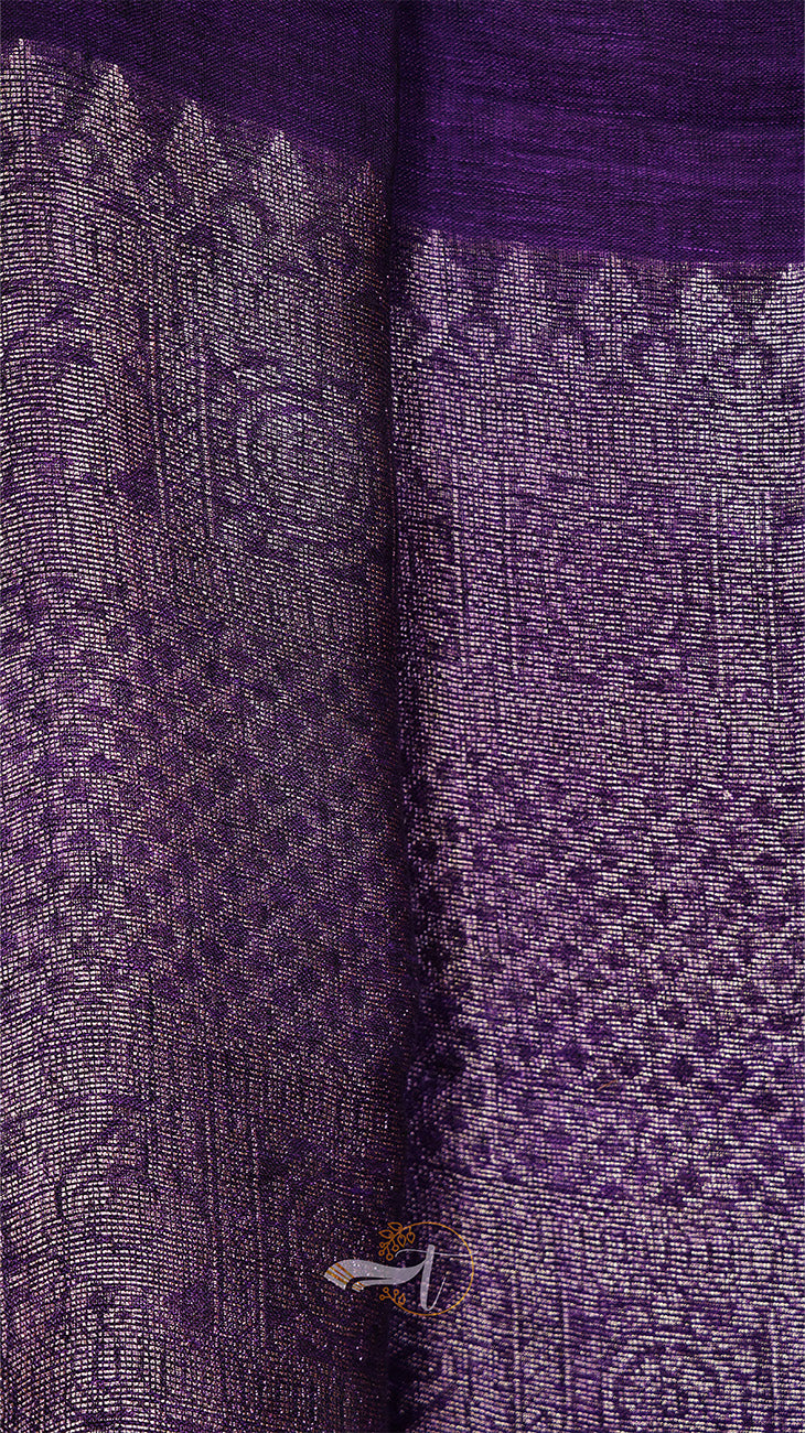 Close-up of a purple fabric with intricate patterns