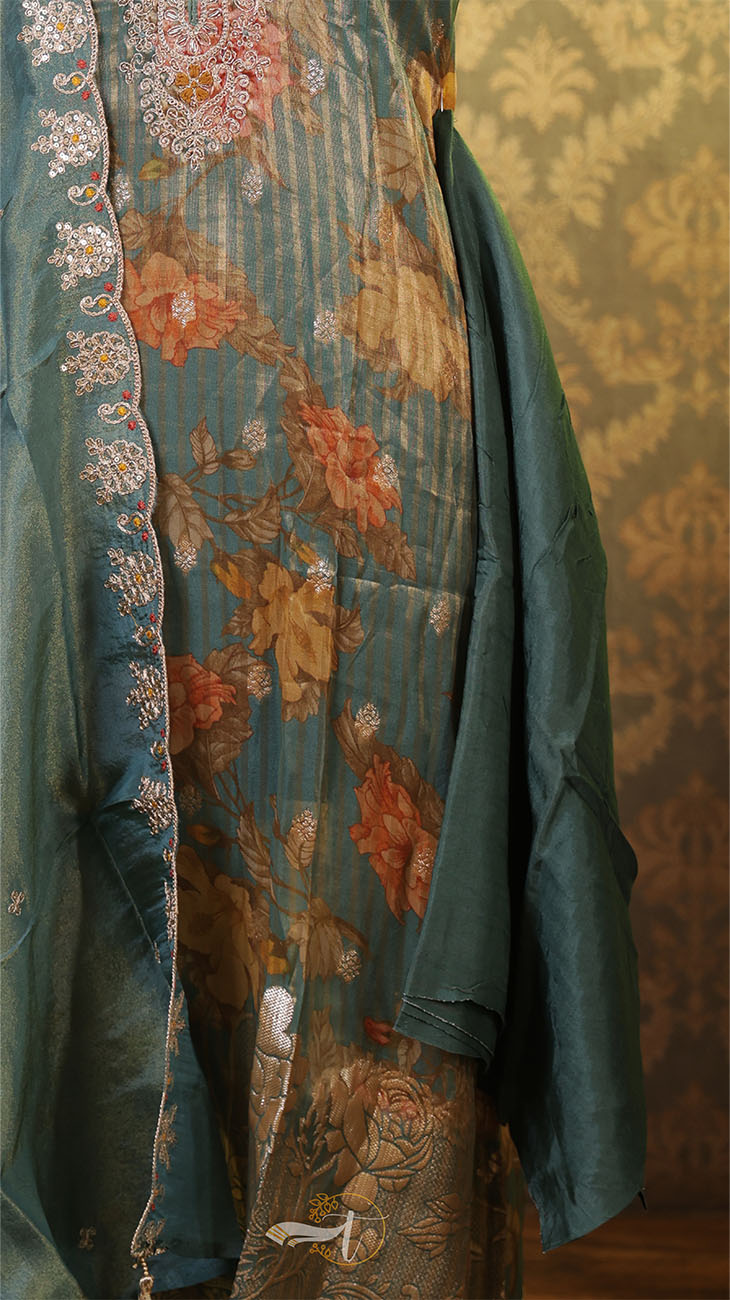 Embroidered garment with floral patterns on a textured wall background