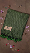 Green striped fabric with a brand tag on a brown background