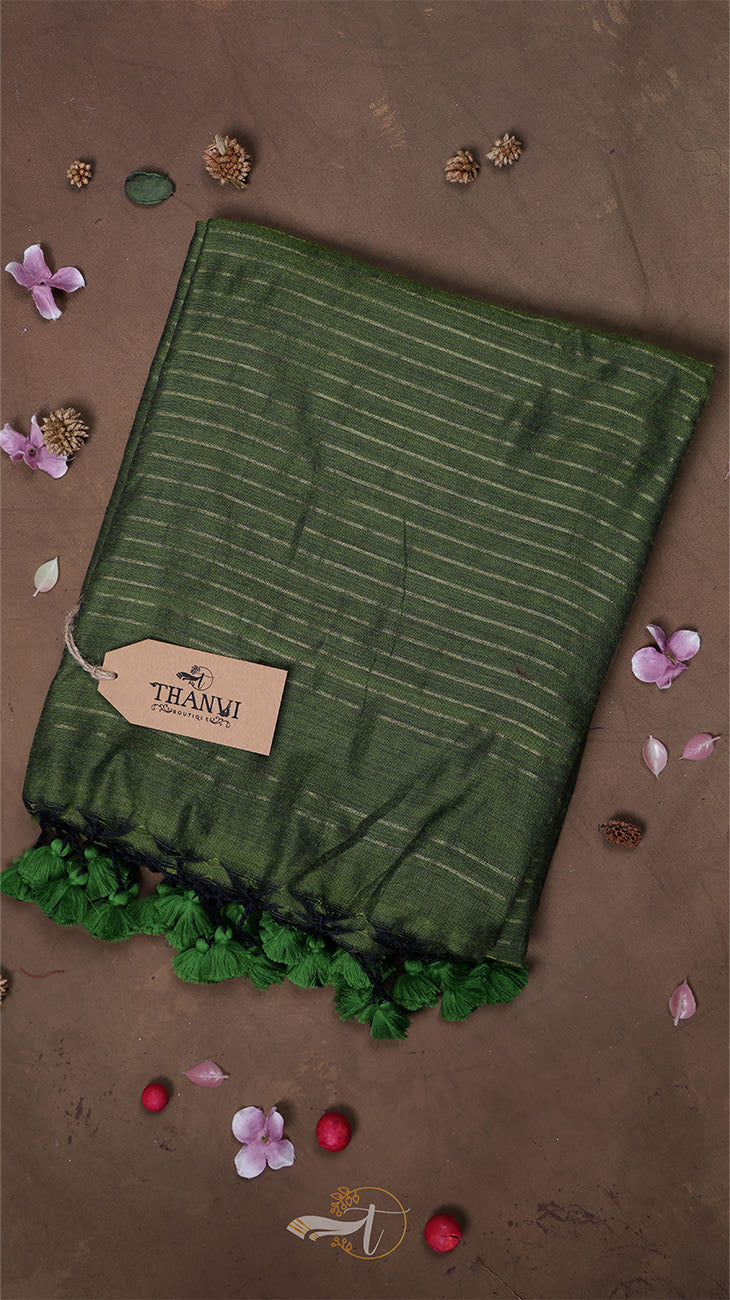 Green striped fabric with a brand tag on a brown background