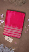 Pink fabric with a patterned border on a brown background, featuring a 'THAVVI' tag.