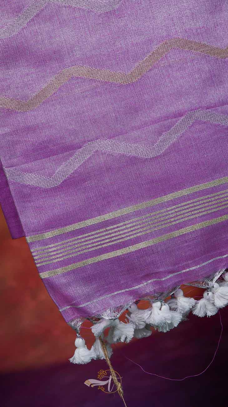 Purple fabric with gold and white stripes and tassels on a red background