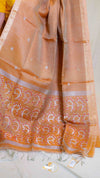 Orange saree with white patterns on a plain background
