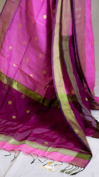 Pink saree with gold patterns on a white background