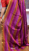 Purple and orange striped saree with a person partially visible