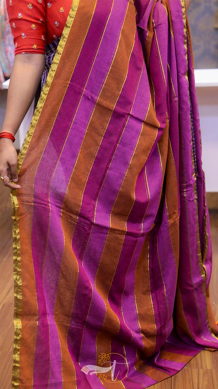 Purple and orange striped saree with a person partially visible