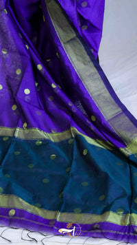 Purple and blue saree with gold border on a white background