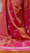 Saree with floral patterns on a pink and orange background