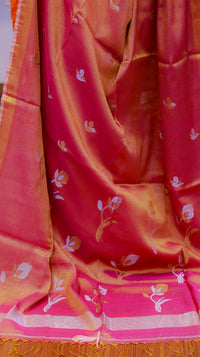 Saree with floral patterns on a pink and orange background