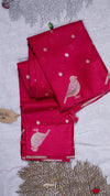 Red saree with bird patterns on a light gray background