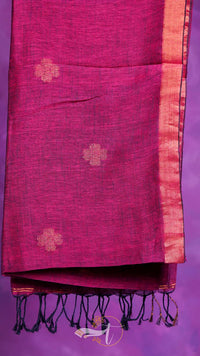 Pink saree with gold floral patterns on a purple background