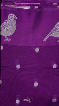 Purple fabric with bird and dot pattern