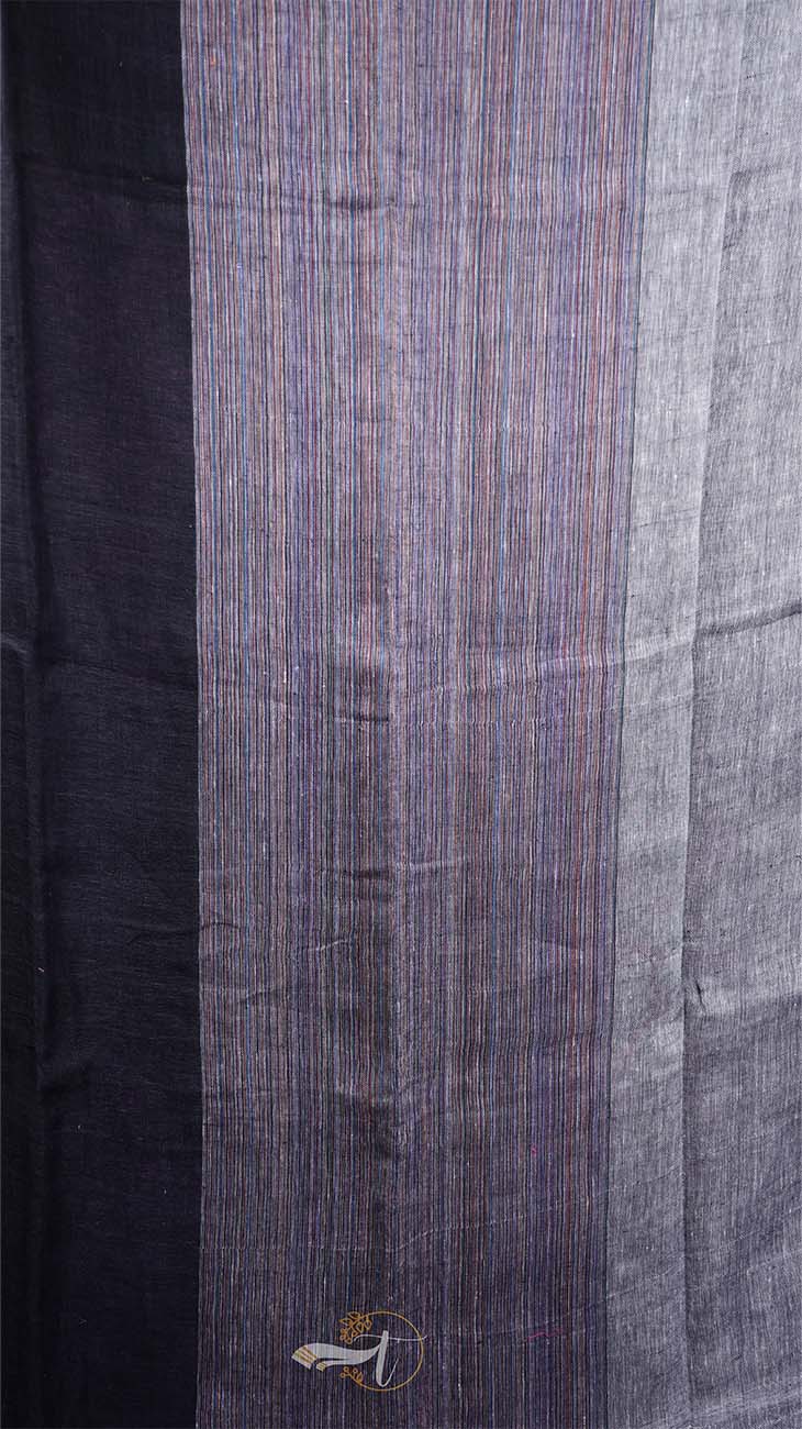 Close-up of a fabric with a striped pattern, transitioning from dark to light blue.
