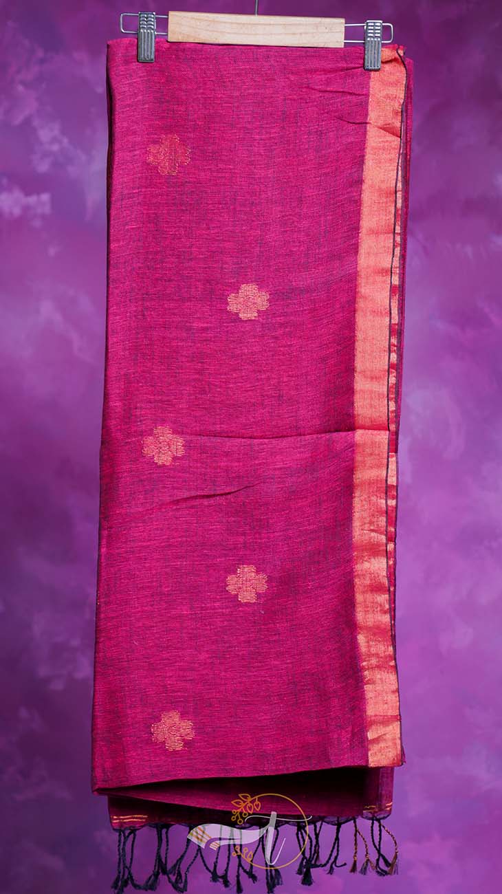 Pink saree with floral patterns on a purple background
