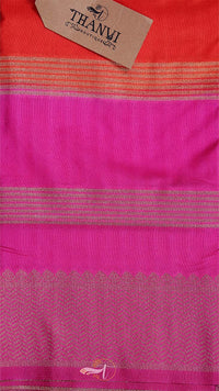 Pink fabric with striped pattern and 'THANUV' brand tag on a red background