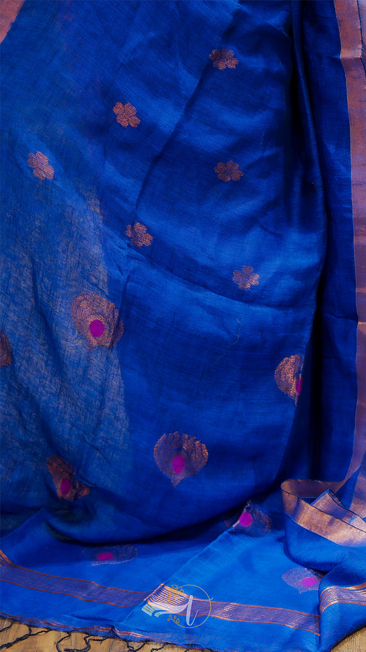 Blue fabric with floral patterns on a wooden surface