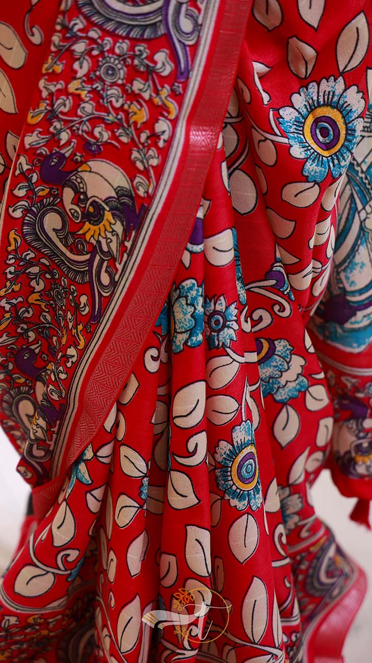 Red fabric with intricate patterns and designs