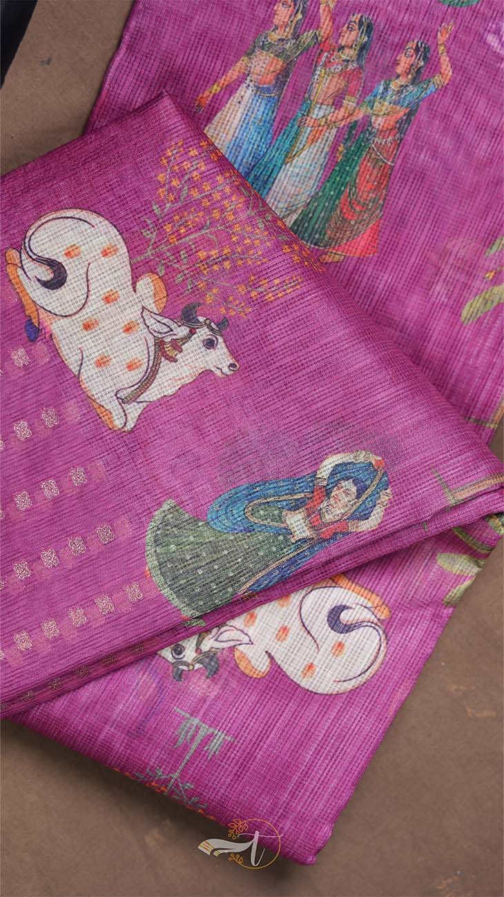 Purple fabric with embroidered designs of people and animals on a brown background