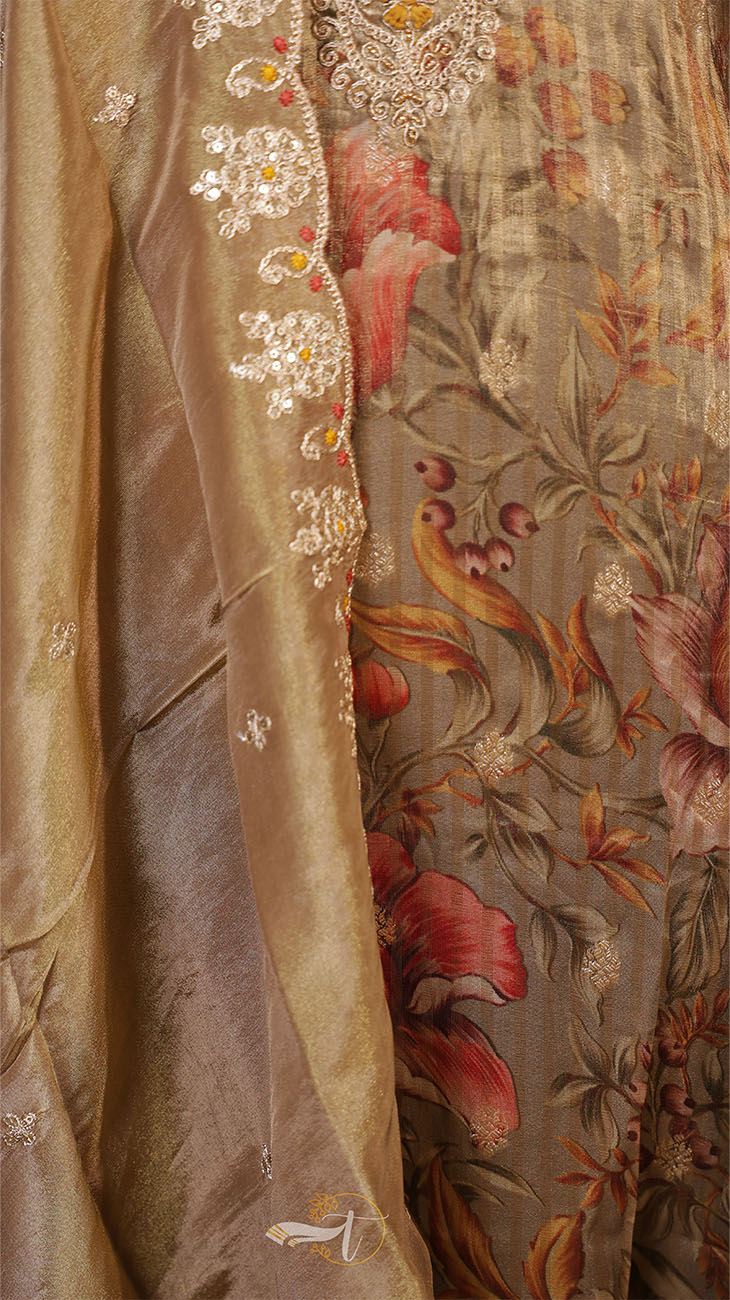 Close-up of a luxurious fabric with floral patterns and embroidery.