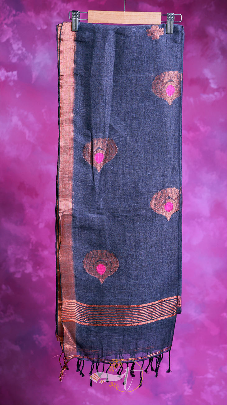 Dark blue scarf with pink and gold patterns on a pink background