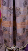 Curtain with decorative patterns and tassels on a purple background